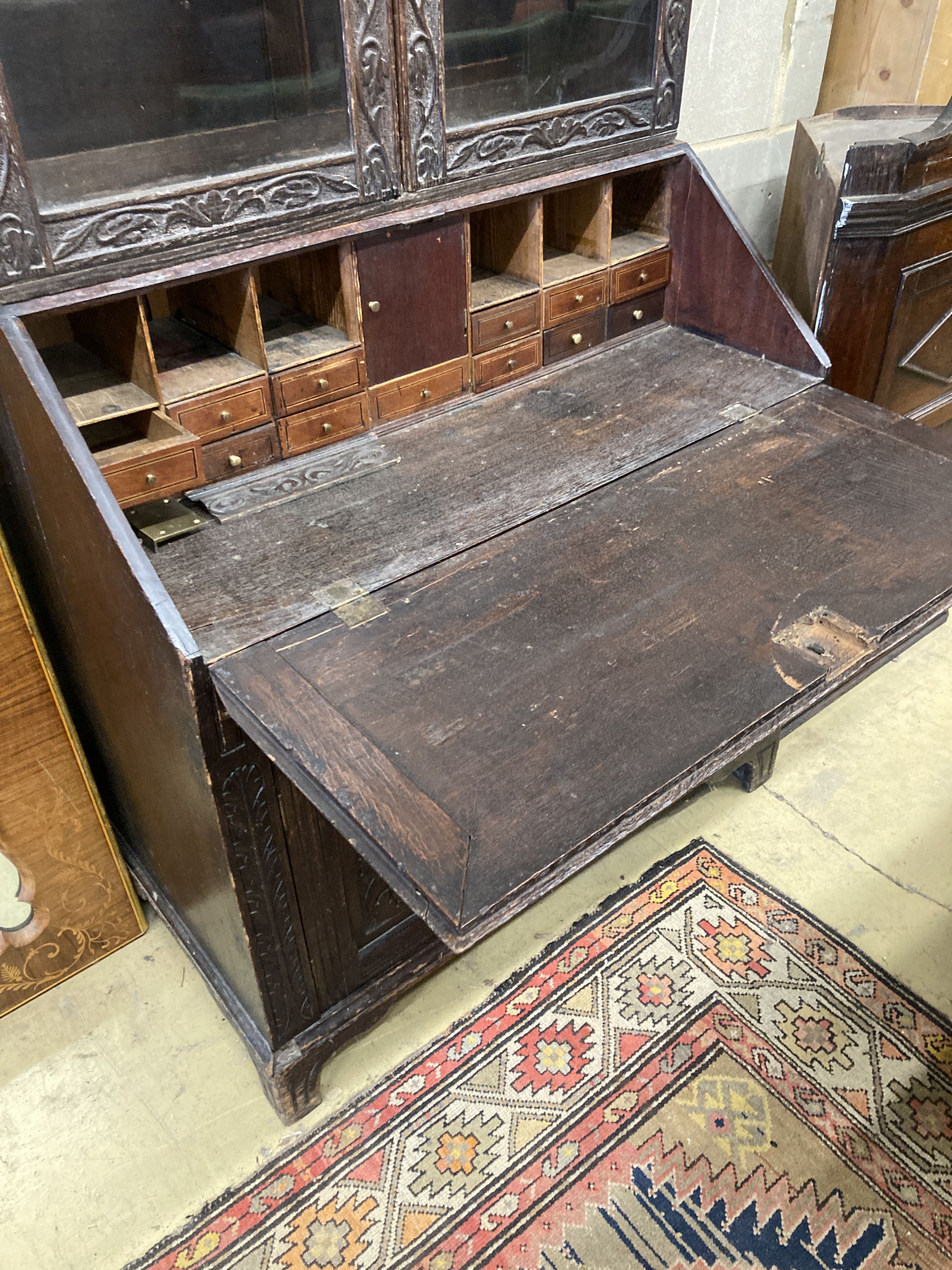 A Victorian carved oak bureau bookcase, width 94cm, depth 54cm, height 203cm